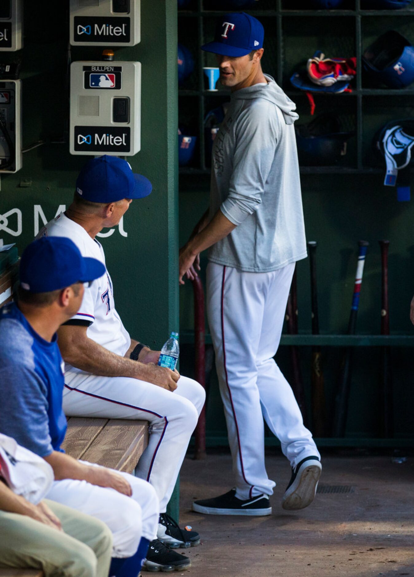 Texas Rangers starting pitcher Cole Hamels (35) greets manager Jeff Banister (28) as he...