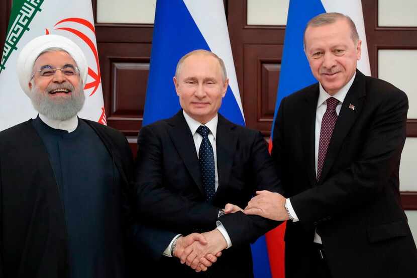 Iranian President Hassan Rouhani (from left),  Russian President Vladimir Putin and Turkish...