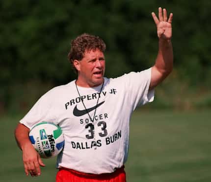 Dallas Burn coach Dave Dir called out instruction during a practice at Greenhill School in...