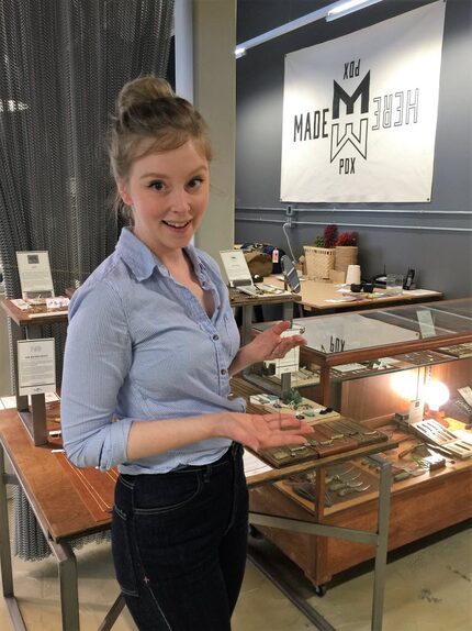 Local jewelry designer Natalie Barela of New Refined Basics holds up a necklace she designed...