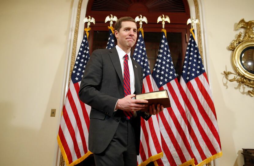 Democrat Conor Lamb of Pennsylvania stands with his Bible before his mock swearing-in...