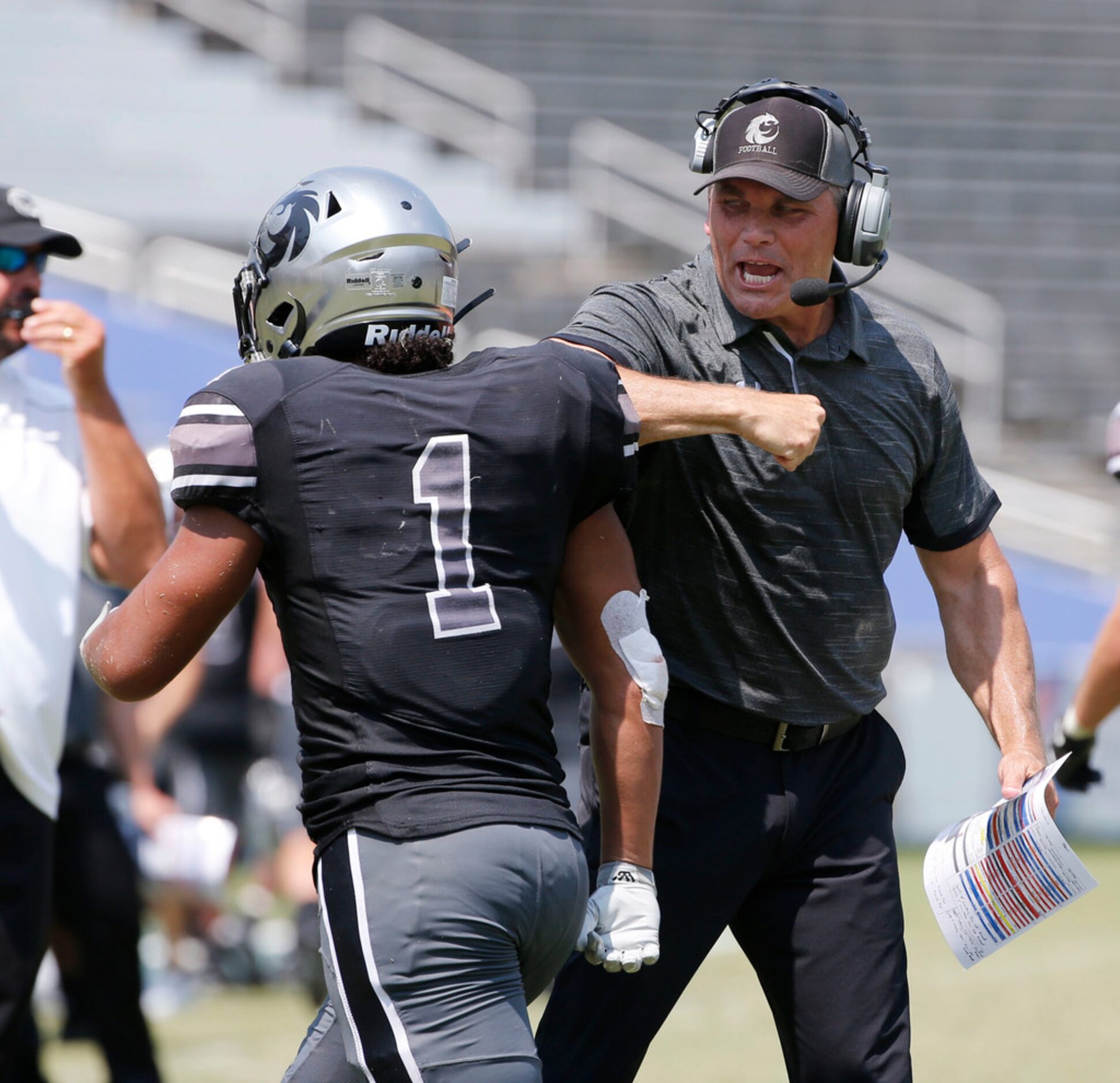 Denton Guyer coach John Walsh celebrates with Kaedric Cobbs (1) after Cobbs scored the...