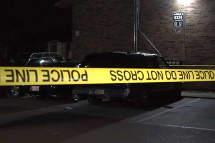 Crime tape marks the area where Fort Worth police investigated the shooting of a woman in...