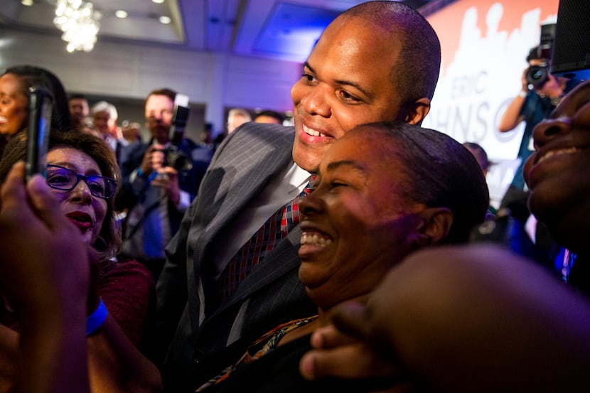 Mayor-Elect Eric Johnson takes picture with supporters after giving remarks during his...