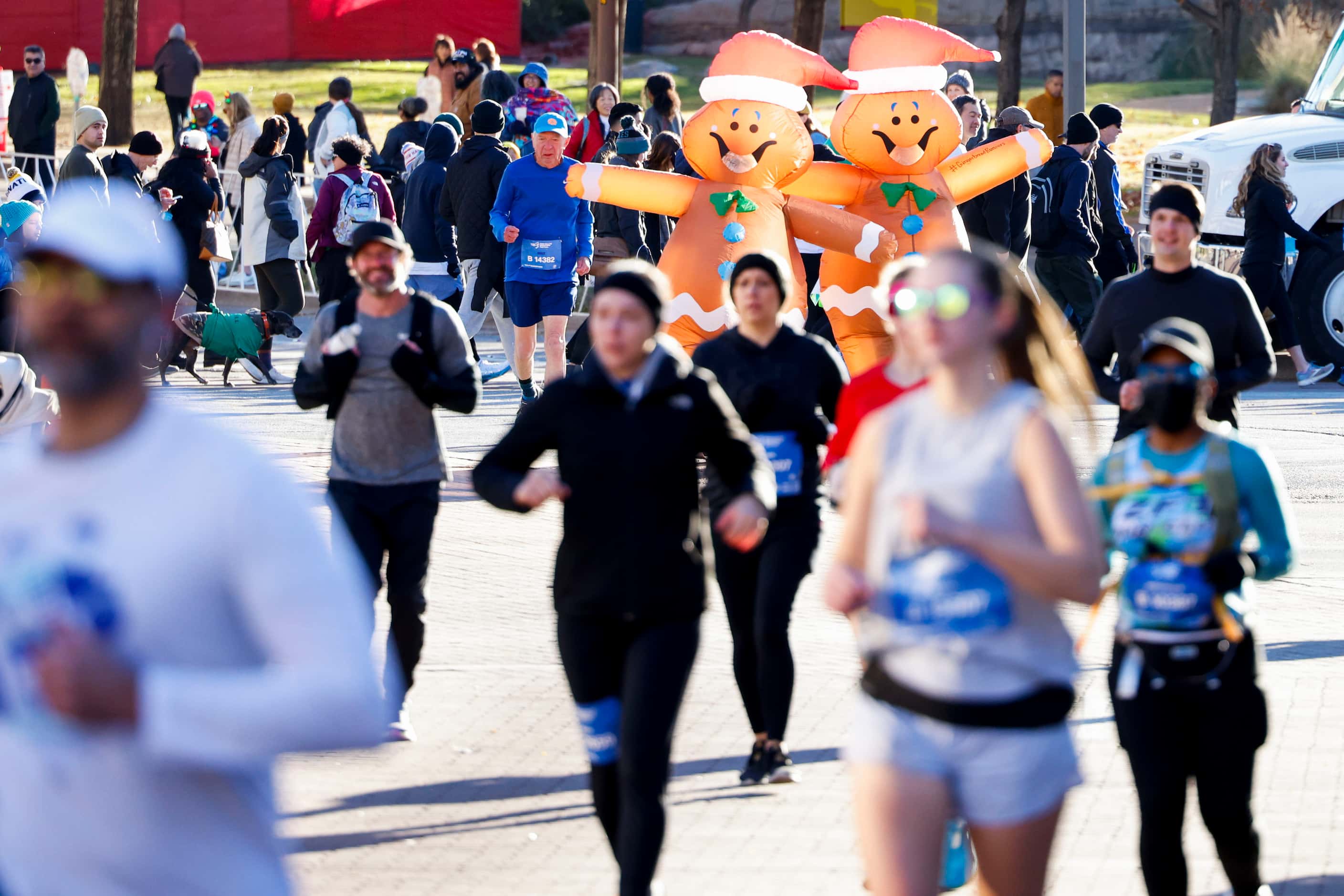 Runners wearing Christmas inflatable costume take part in 2023 BMW Dallas Marathon on,...