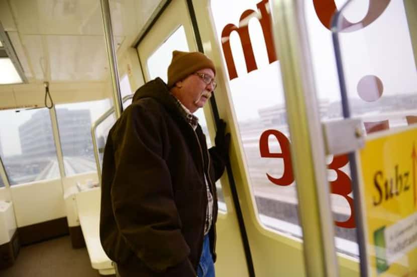 
Johnny Williams, manager for the Las Colinas Area Personal Transit System, checks the line...