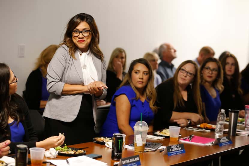 *Frances Castaneda smiles as she introduces herself during a quarterly managers meeting at...