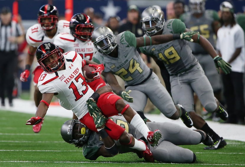 Baylor Bears wide receiver Davion Hall (16) tackles Texas Tech Red Raiders wide receiver...