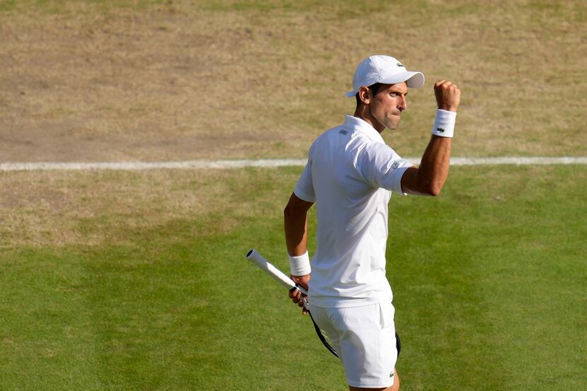 Serbia's Novak Djokovic reacts as he plays Britain's Cameron Norrie in a men's singles...