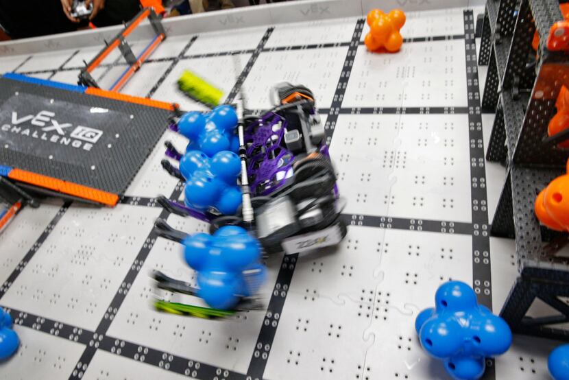 Wildbot manipulates modules during robotics club at Winnetka Elementary in Dallas on May 26,...
