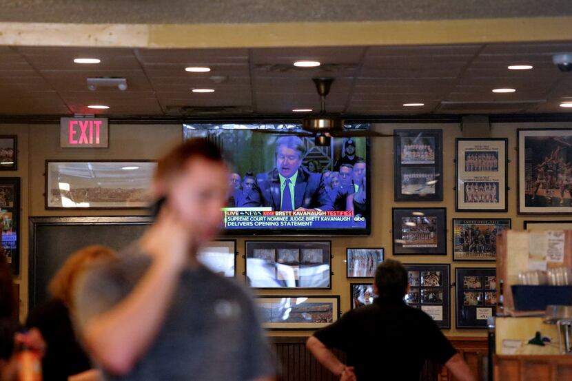 A TV inside Yorkside Pizza Restaurant shows the U.S. Senate Judiciary Committee hearings for...