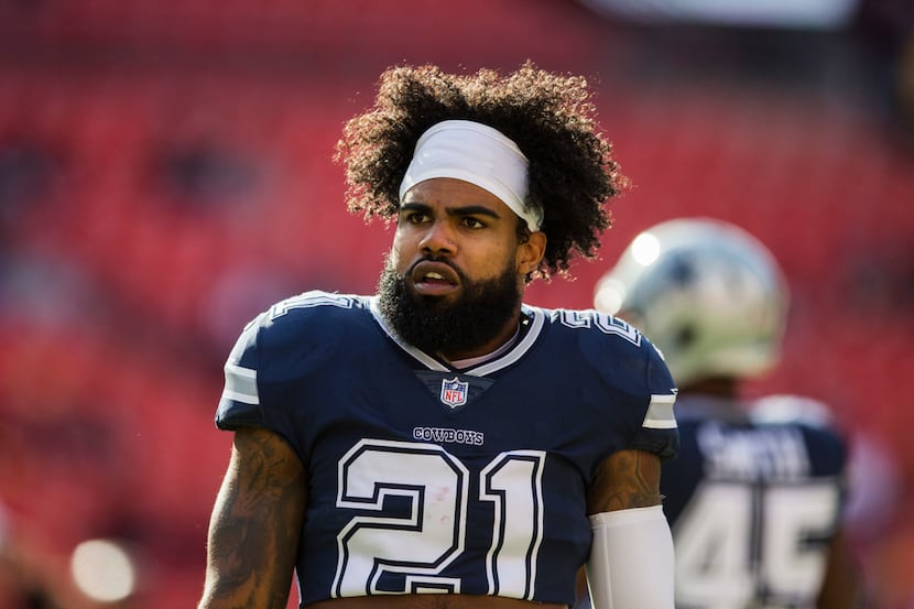 Dallas Cowboys running back Ezekiel Elliott (21) warms up before an NFL game between the...