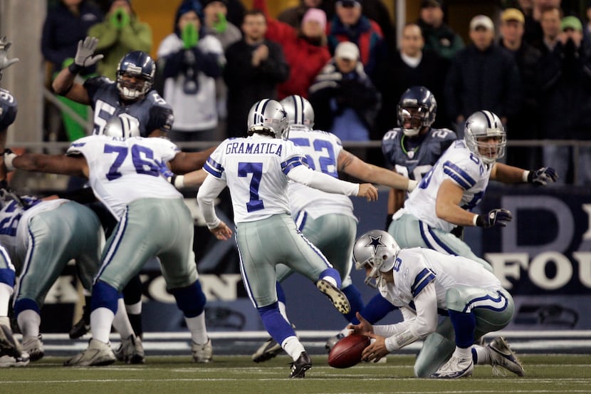 Dallas Cowboys' Tony Romo, right, botches the hold on a 19-yard field goal-attempt by Martin...
