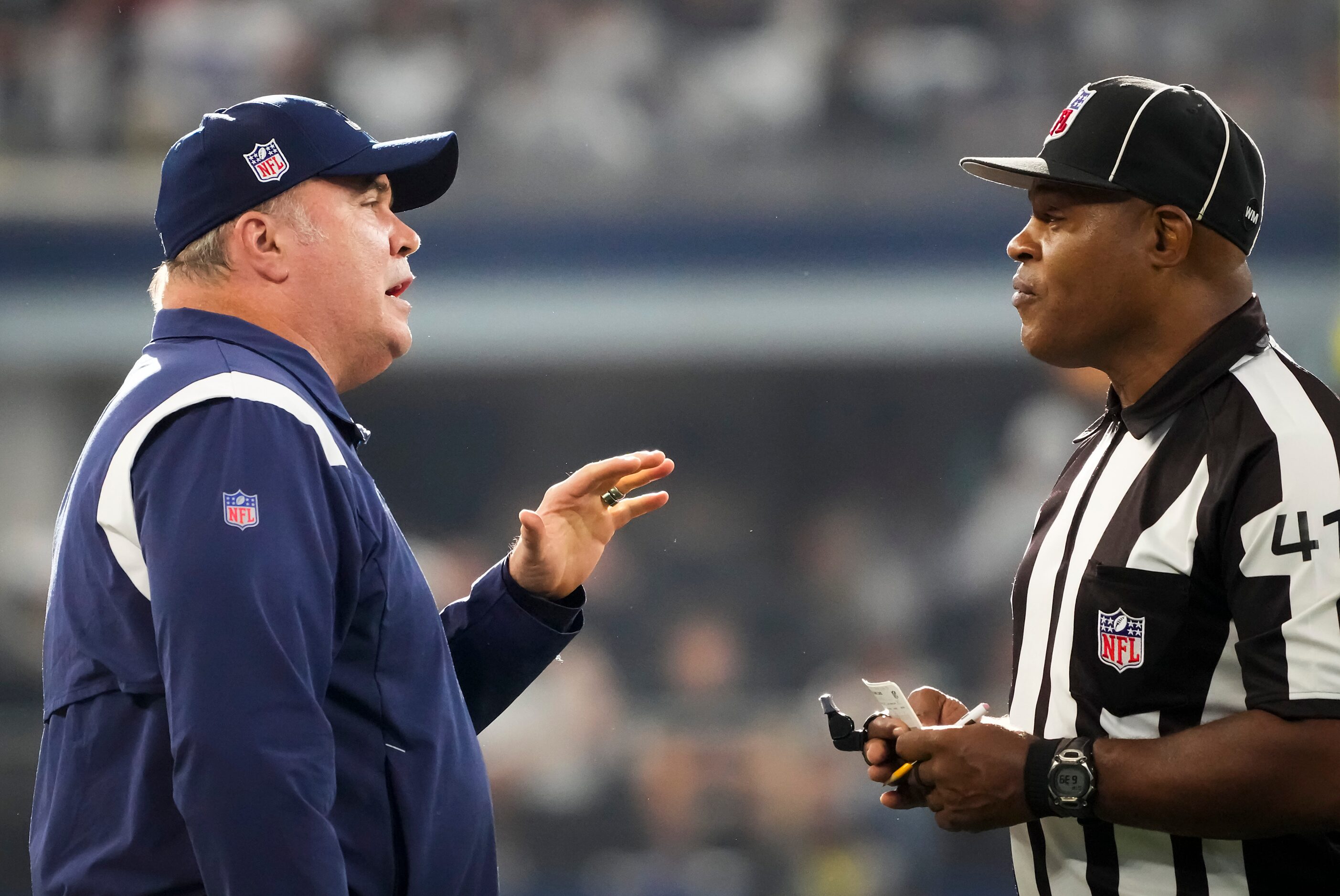 Dallas Cowboys head coach Mike McCarthy talks with side judge  Boris Cheek during the fourth...