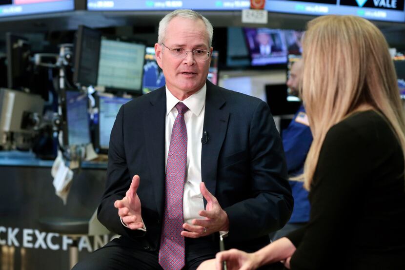 Exxon Mobil Chairman & CEO Darren Woods is interviewed on the floor of the New York Stock...