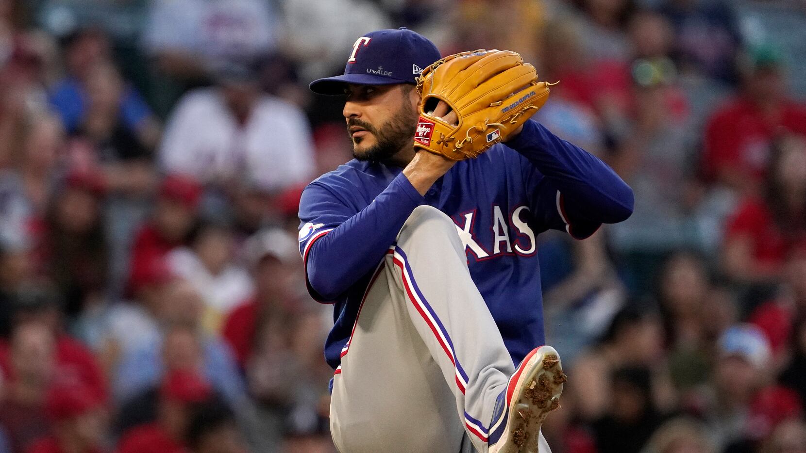 Texas Rangers starting pitcher Martin Perez throws to the plate during the fourth inning of...