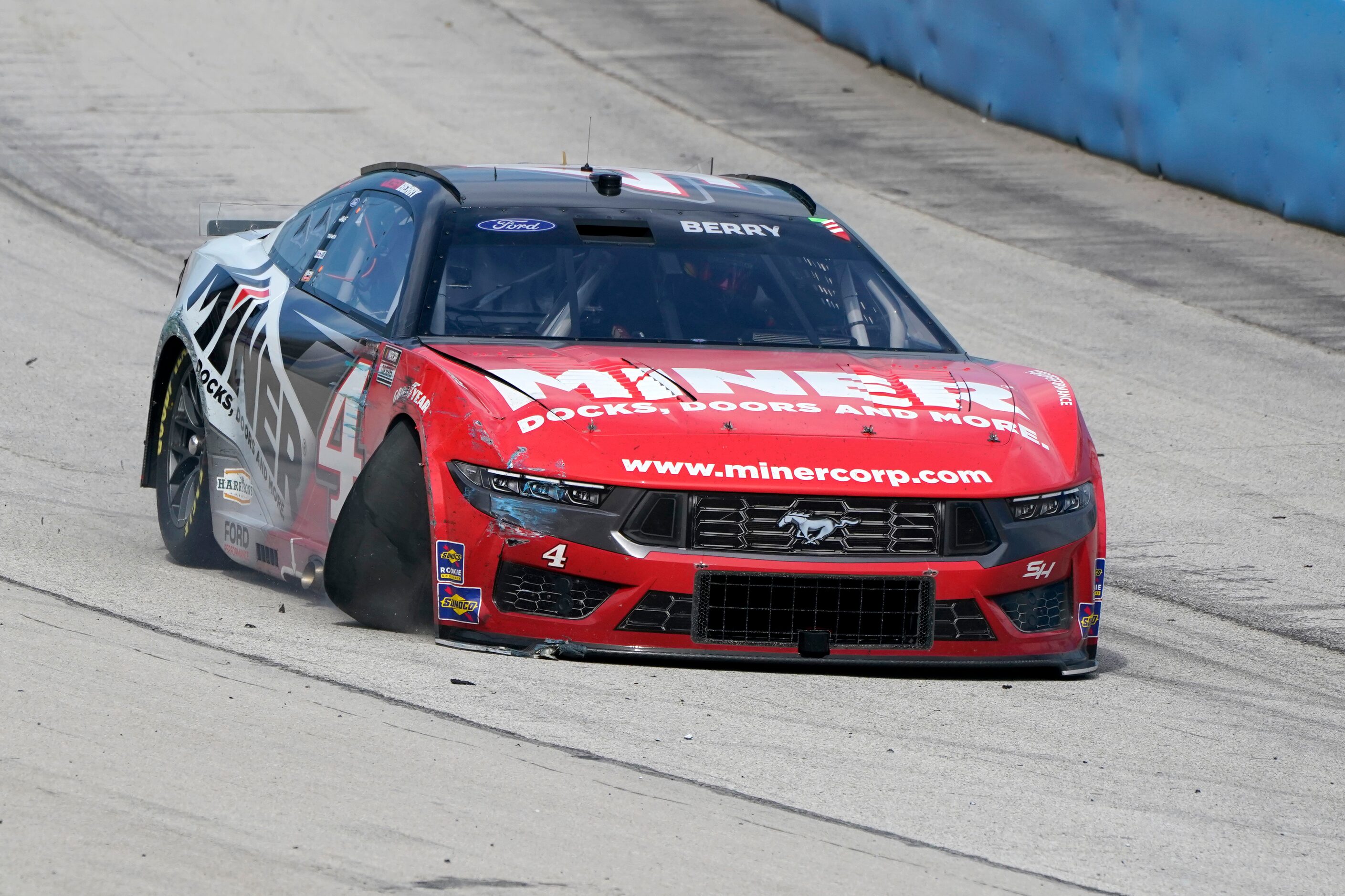 Josh Berry heads into pit road with his damaged car during the NASCAR Cup Series auto race...