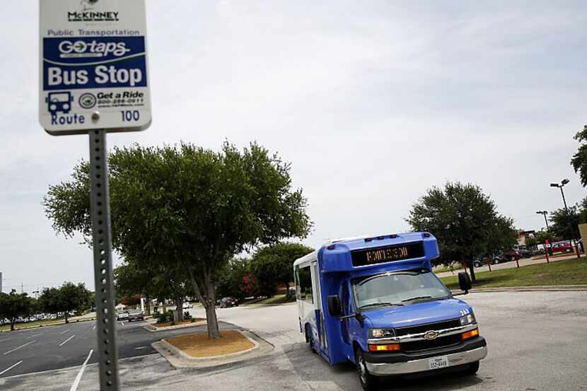  A Texoma Area Paratransit System (TAPS) bus arrives at a stop on University Boulevard in...