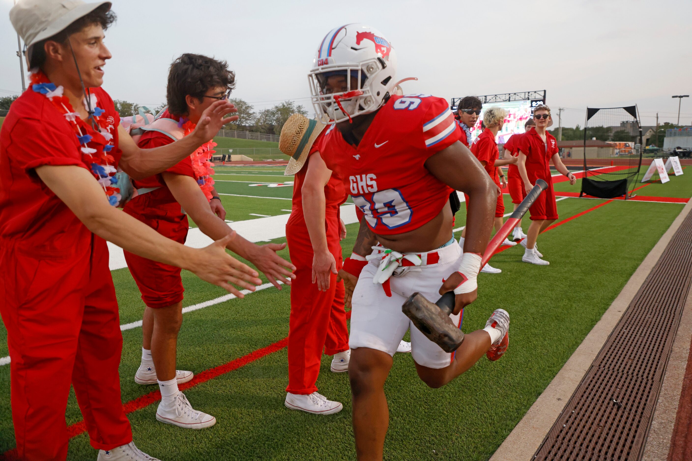 Grapevine player Devin Thomas deliverst the sledgehammer prior to playing Frisco Wakeland...