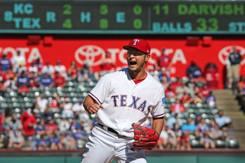 Texas Rangers starting pitcher Yu Darvish (11) reacts to Kansas City Royals second baseman...