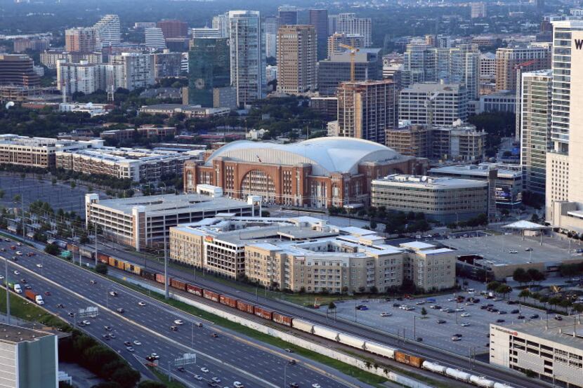 An aerial shot of American Airlines Center surrounded by condominiums along I-35E in Dallas,...
