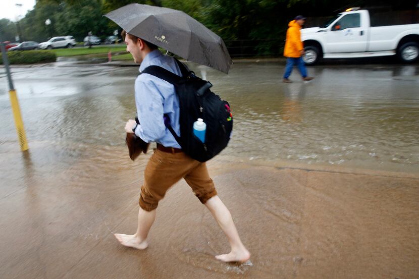 Brandon Berens, a Music Education senior at UT-Arlington, took off his socks and shoes in...