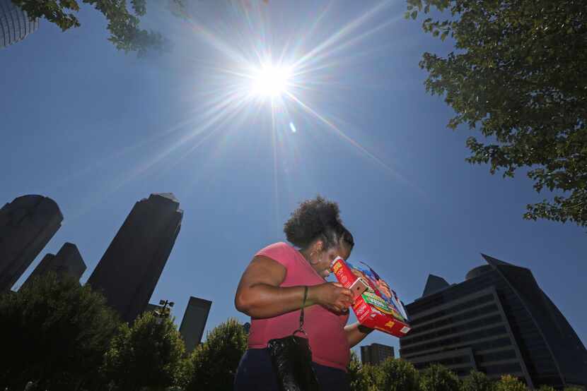 Tiffany Francis uses a Lucky Charms cereal box to view the partial solar eclipse at Klyde...