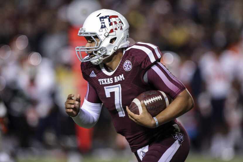 Texas A&M Aggies quarterback Kenny Hill (7) runs with the ball during the third quarter...
