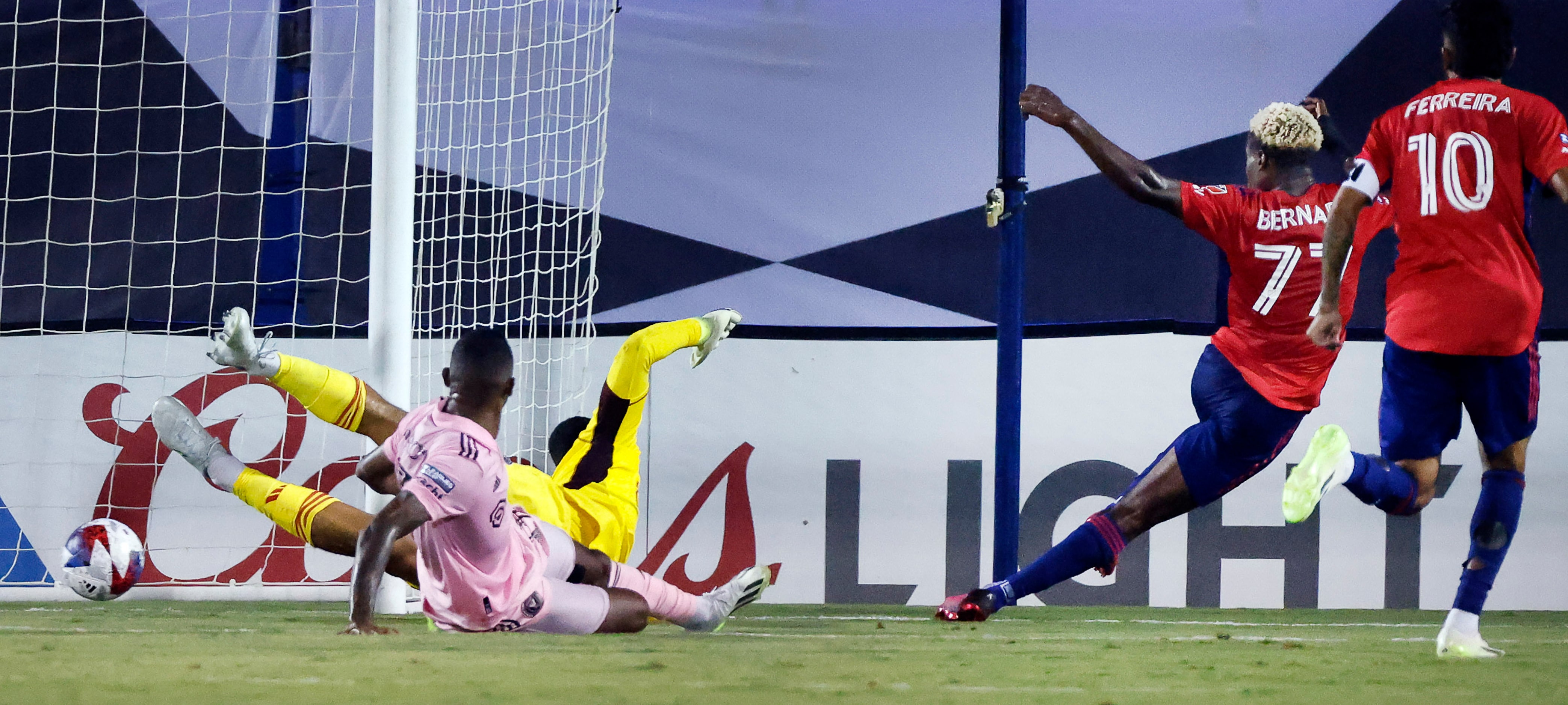 FC Dallas forward Bernard Kamungo (77) shoots and scores past Inter Miami goalkeeper Drake...