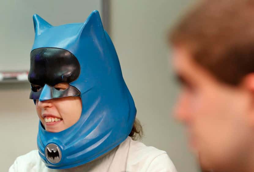 
Nan, one of the students in Starr’s Comics Club, tries on a vintage Batman mask.
