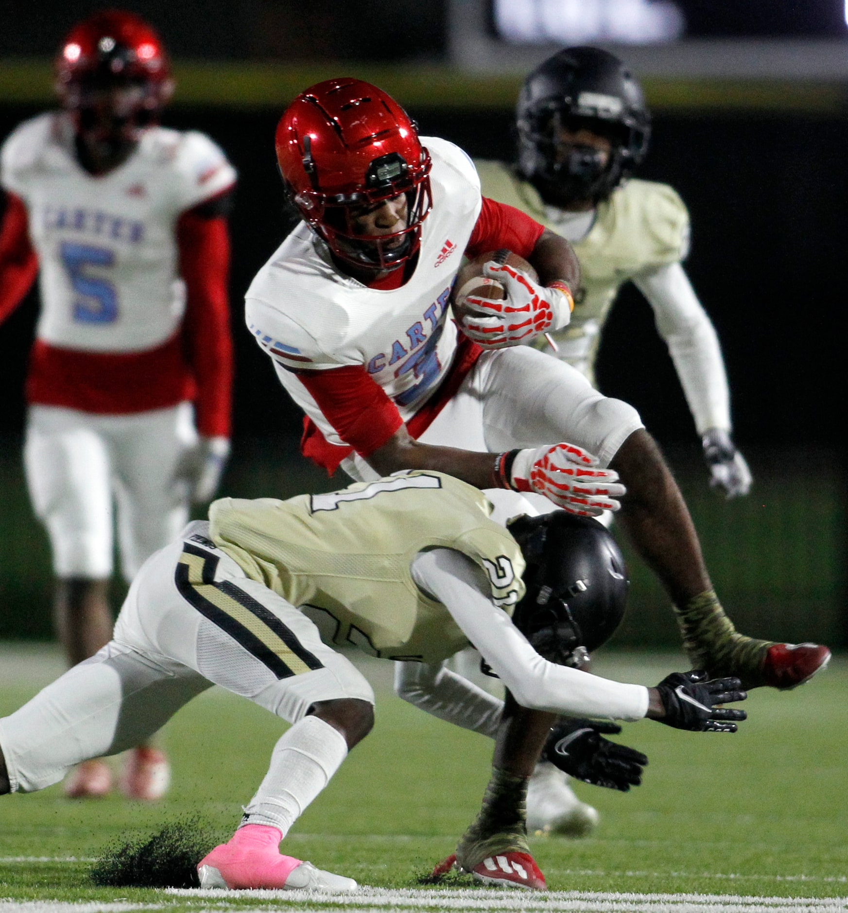 Dallas Carter running back Brandon Jones (3) is tackled by Dallas Pinkston cornerback Kenyon...