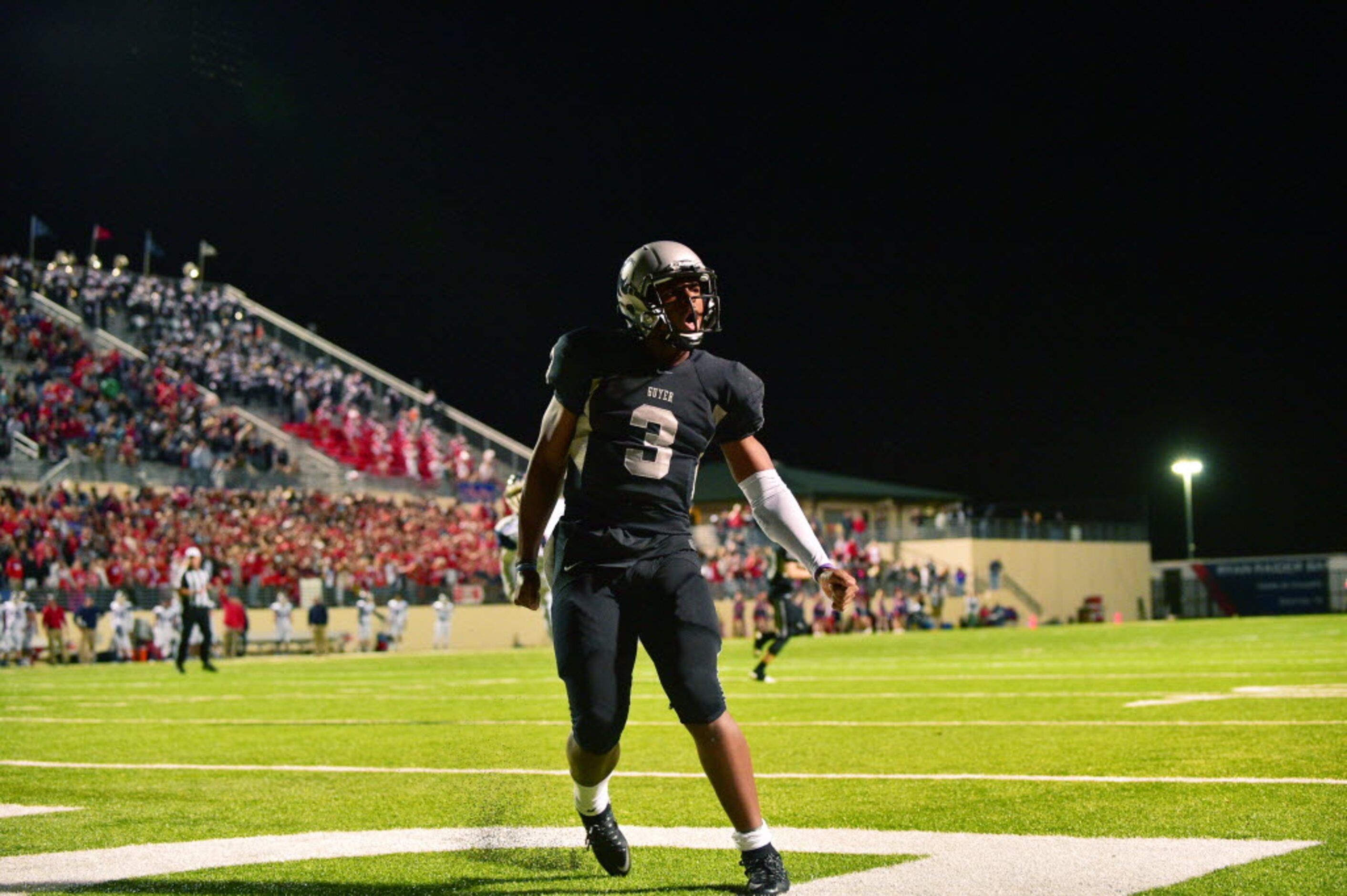 Guyer junior quarterback Shawn Robinson (3) celebrates after a rushing touchdown against...