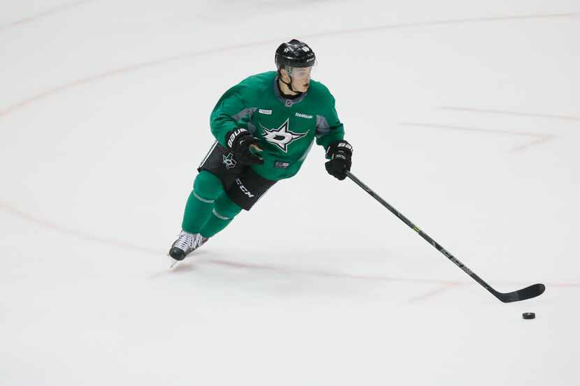 Dallas Stars Julius Honka controls the puck while he plays in a game during the first day of...
