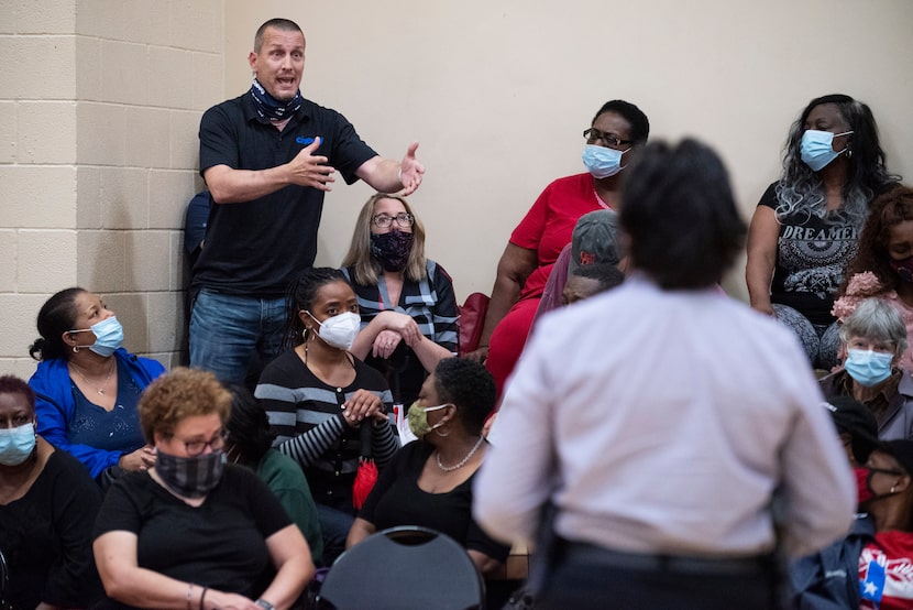 Chris Reno (left) asked Dallas police Chief Eddie Garcia (not pictured) and Lt. Carrie Wise...