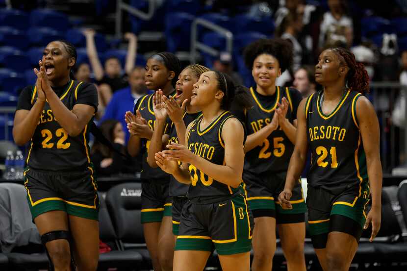 DeSoto's Mylasia Smith (00) begins the team celebration as DeSoto defeated Pearland 56-35 in...
