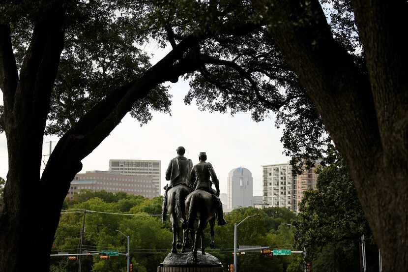A  statue of Confederate general Robert E. Lee  stands in Lee Park in the Oak Lawn...