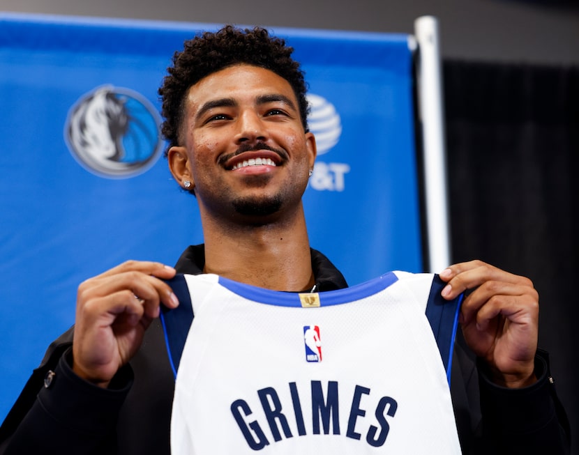 Quentin Grimes poses with his jersey following a NBA news conference where he was introduced...