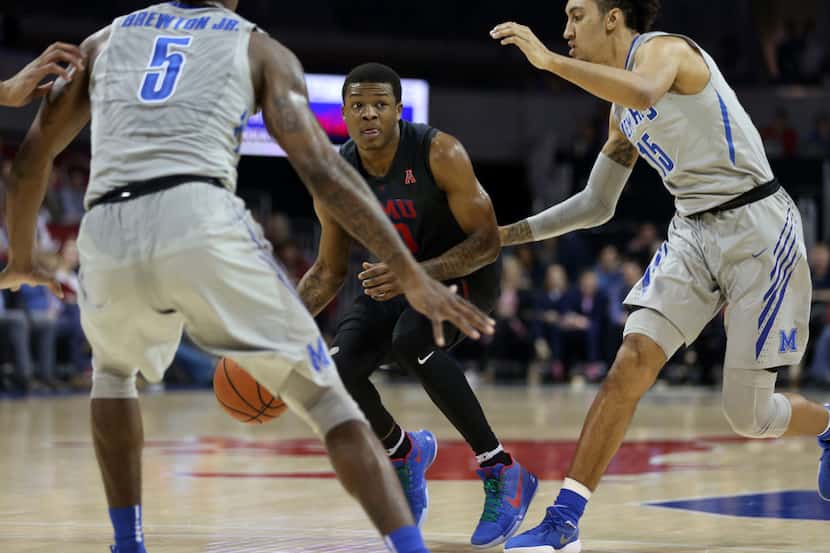 Southern Methodist Mustangs guard Jahmal McMurray (0) drives the ball against Memphis Tigers...