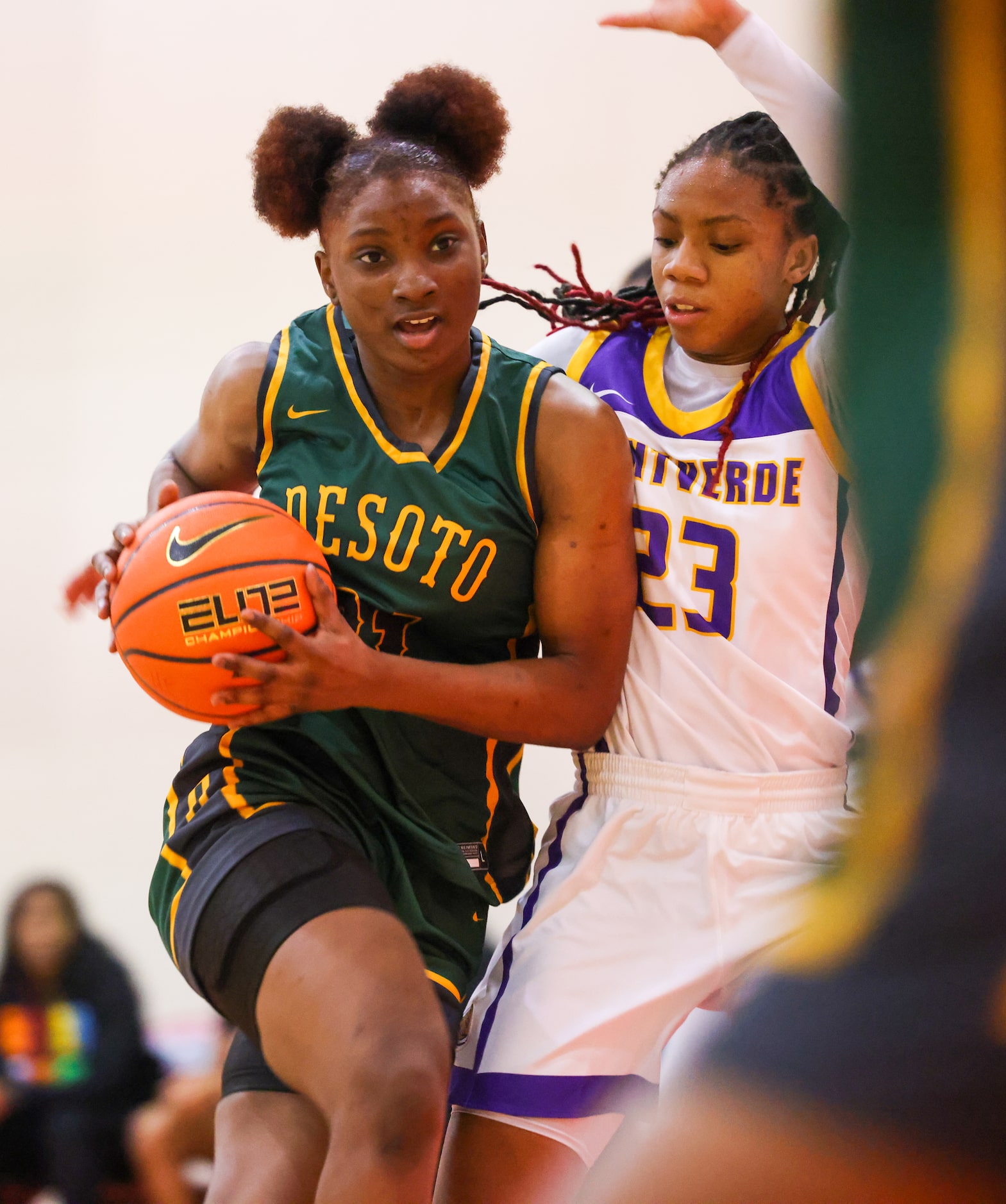 DeSoto shooting guard MaRiya Vincent (21) pushes past Montverde Academy Mjraela Sheppard...