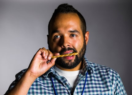 Audience team member Dennis Jansen tastes the coffee candy cane. It's fine, whatever.