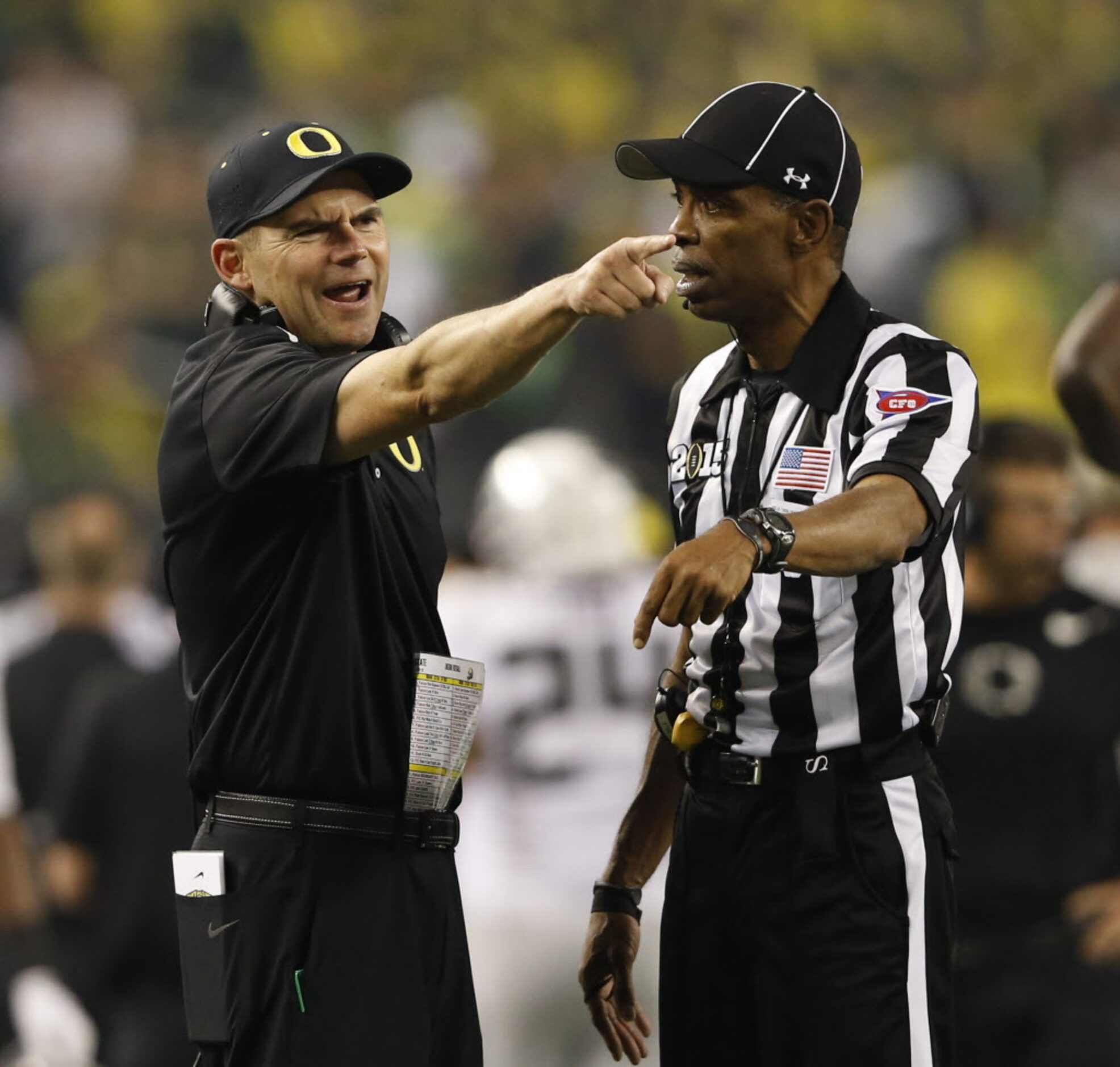 Oregon Ducks head coach Mark Helfrich argues with a refreree during the second half of the...