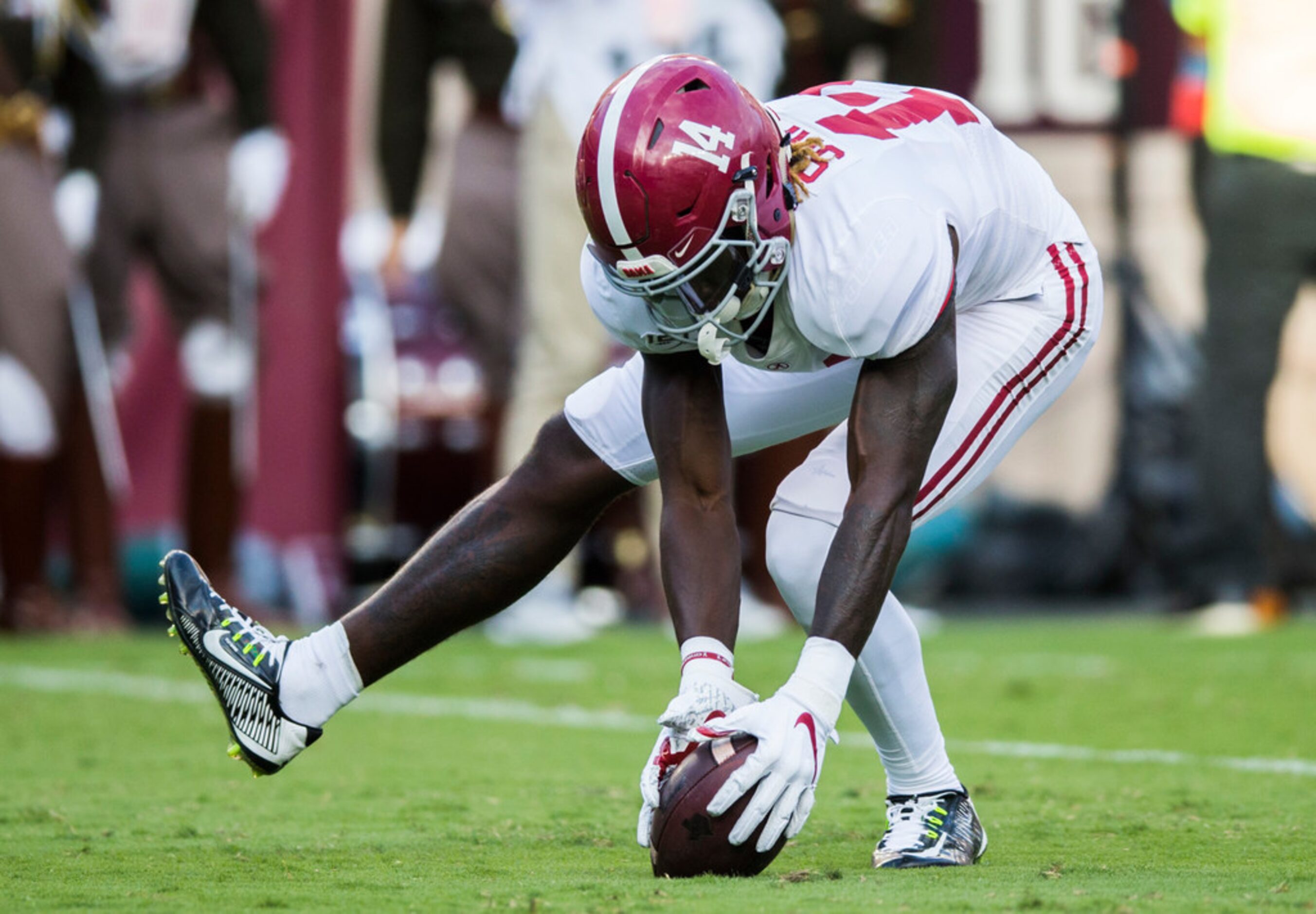 Alabama Crimson Tide wide receiver Tyrell Shavers (14) picks up a blocked punt and runs it...