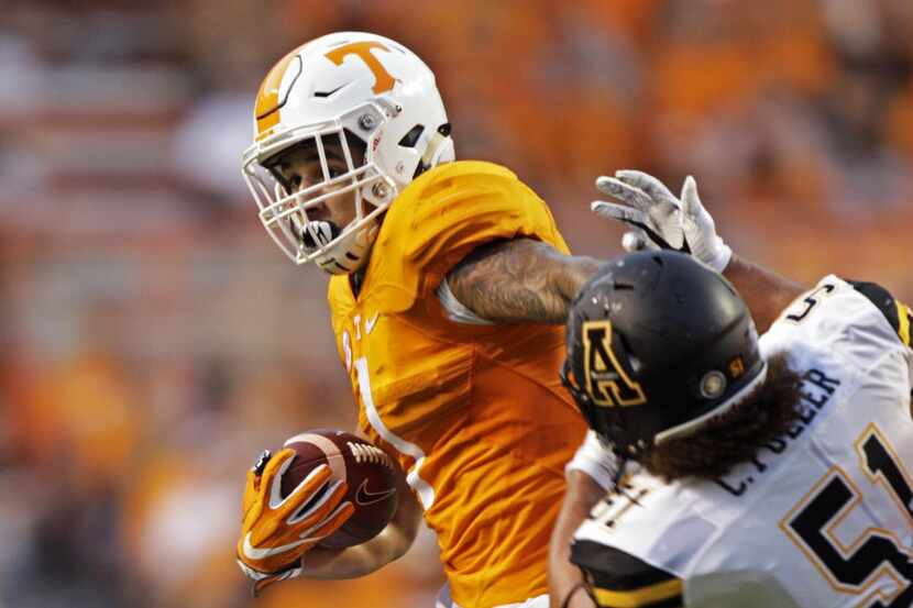 Tennessee running back Jalen Hurd (1) escapes from Appalachian State defensive lineman Caleb...