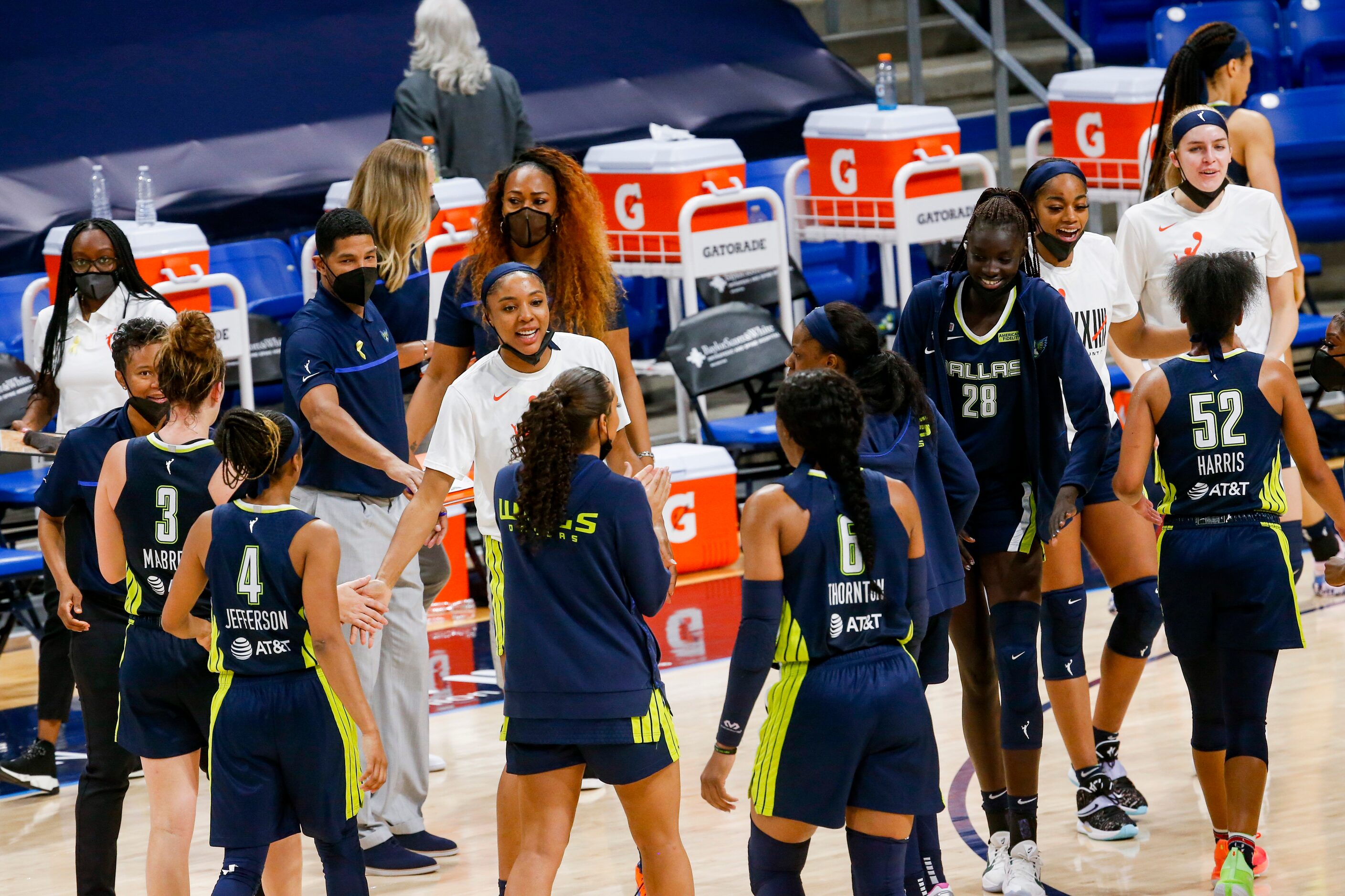 Dallas Wings celebrate leading against the Los Angeles Sparks in the fourth quarter at...