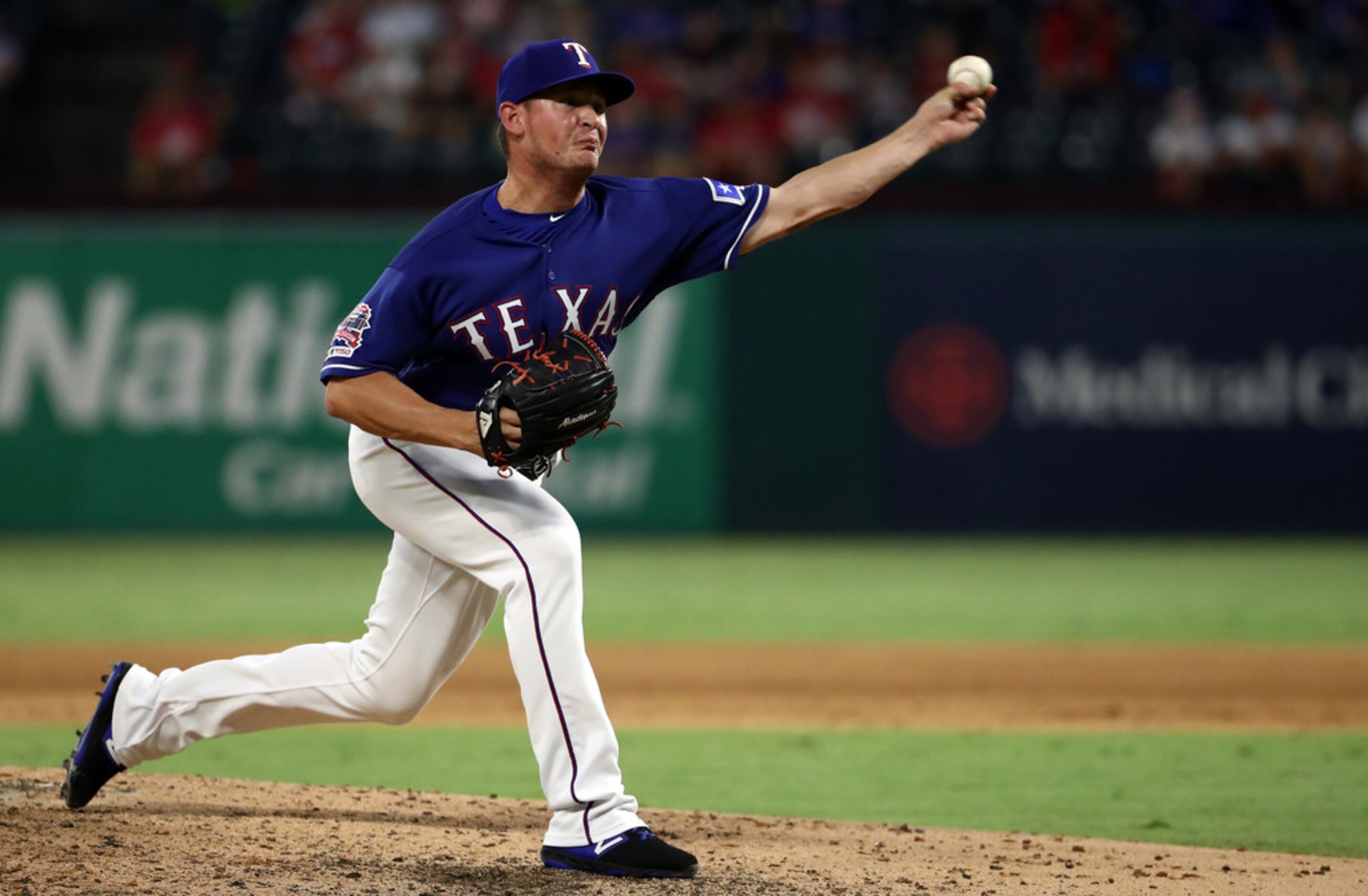 ARLINGTON, TEXAS - AUGUST 21:  Locke St. John #45 of the Texas Rangers throws against the...