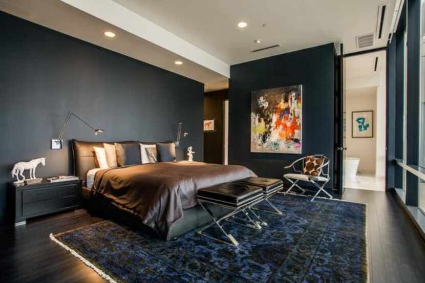 
The walls of the second-floor master bedroom and study are black to create an ambience of...