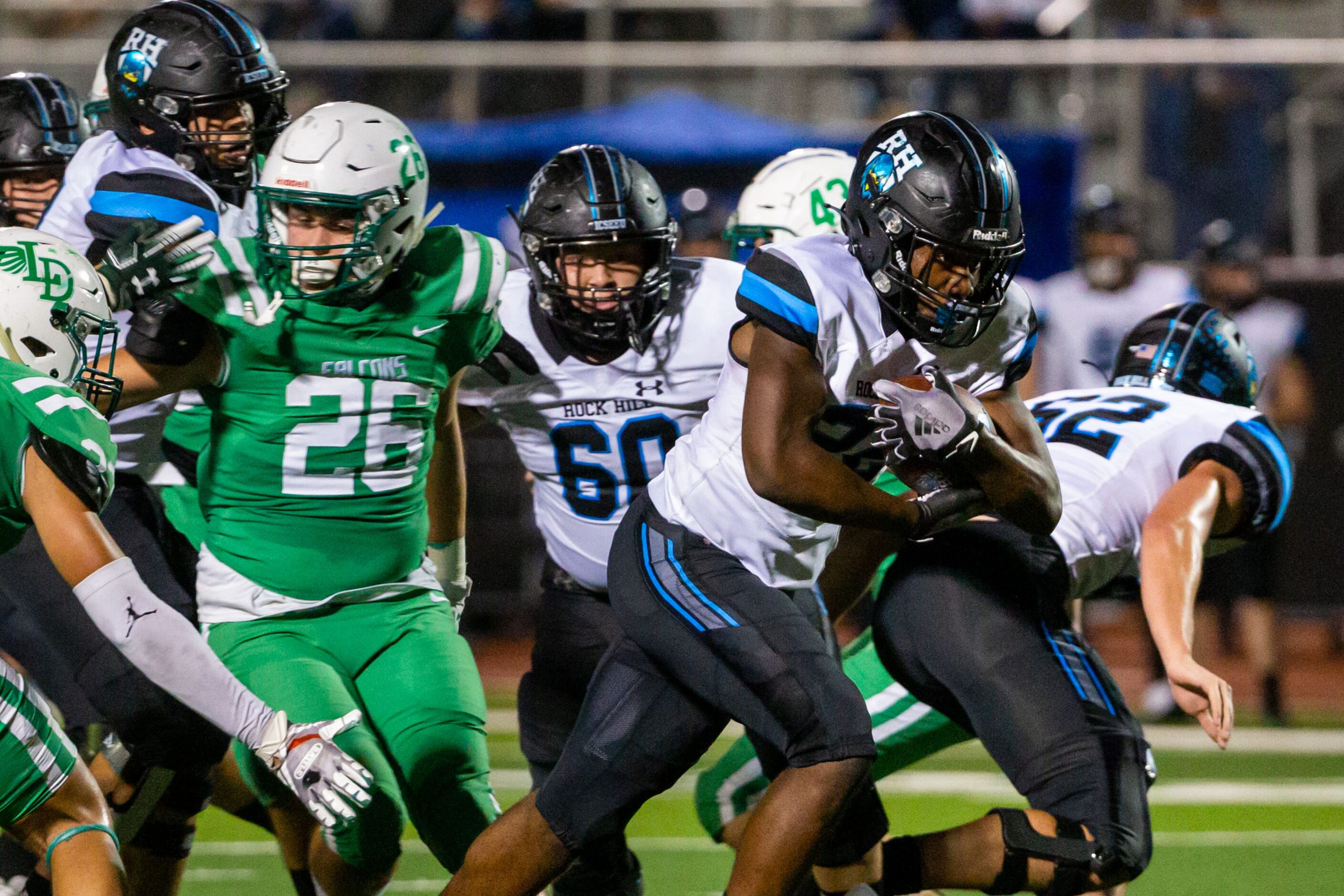 Rock Hill running back Donovan Shannon (22) tries to push through Dallas Lake defense during...