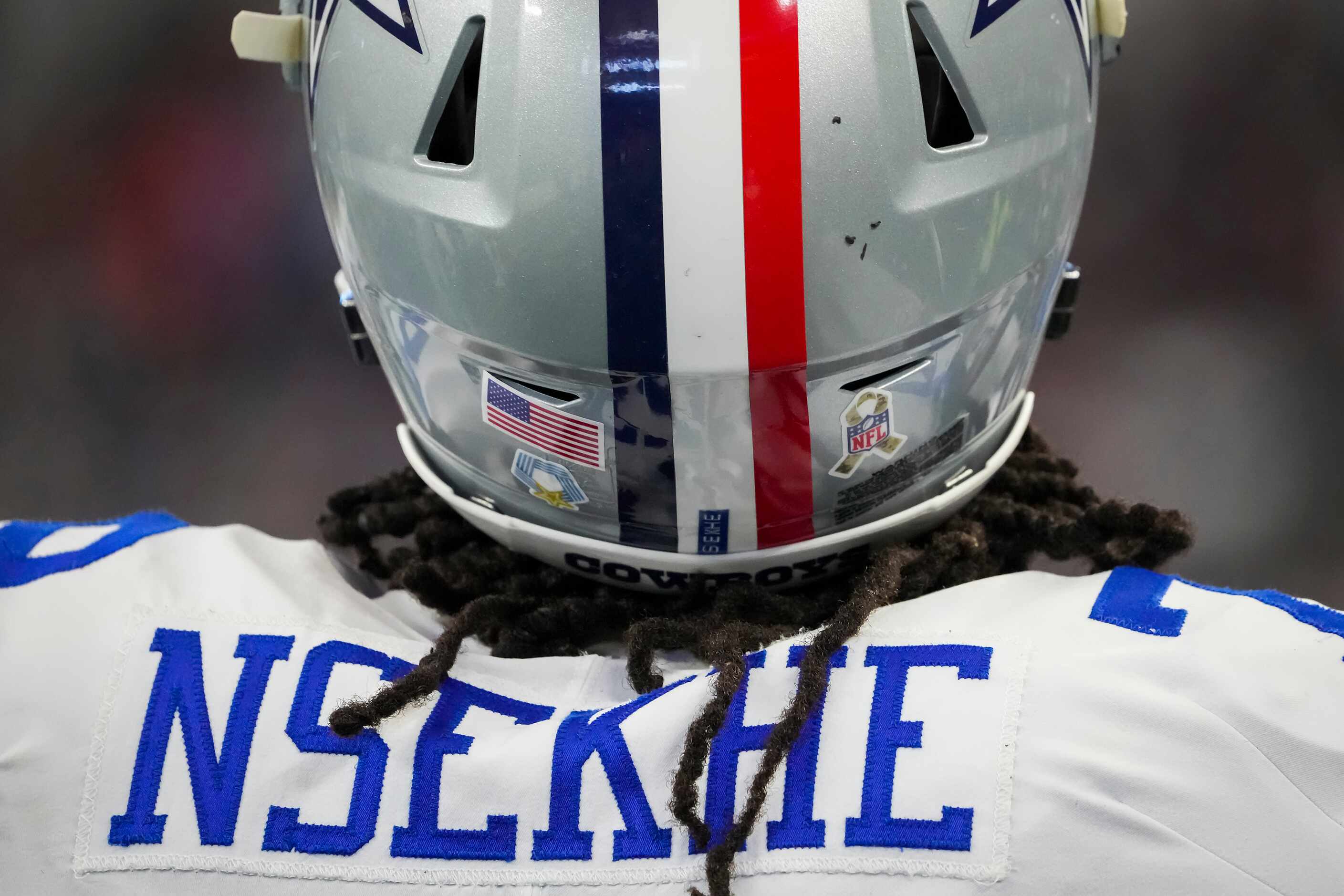Dallas Cowboys offensive tackle Ty Nsekhe (79) wears a helmet featureing a red stripe and...