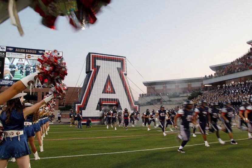 The Allen Eagles take the field for their first game of the new season during as Allen High...