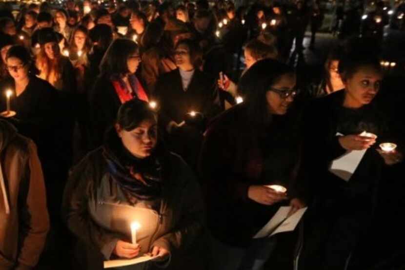  At a candlelight vigil outside the home of Baylor University President Ken Starr on Feb. 8,...